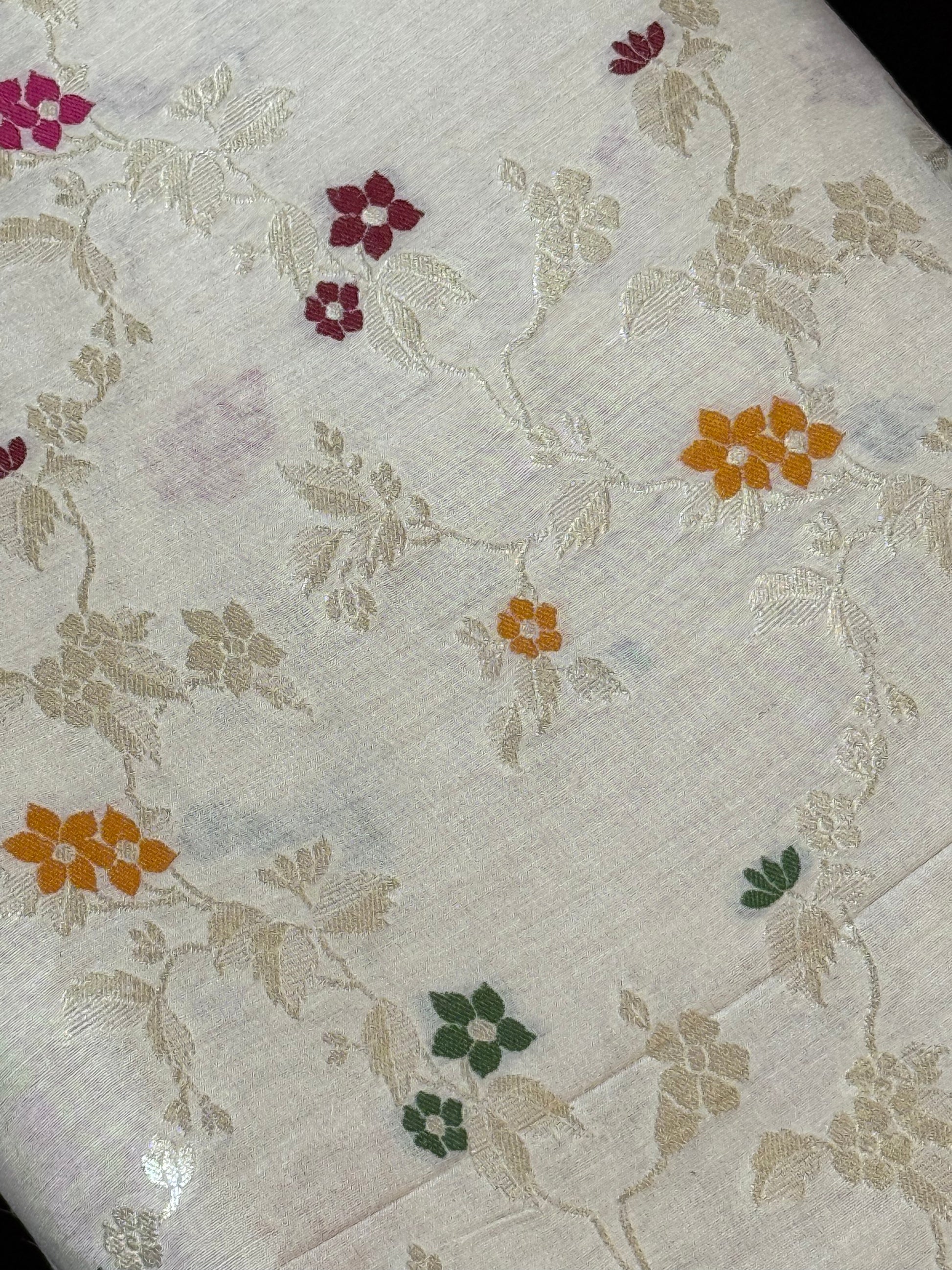 Muga Silk Fabric enhanced with jaal design, intricate meenakari work