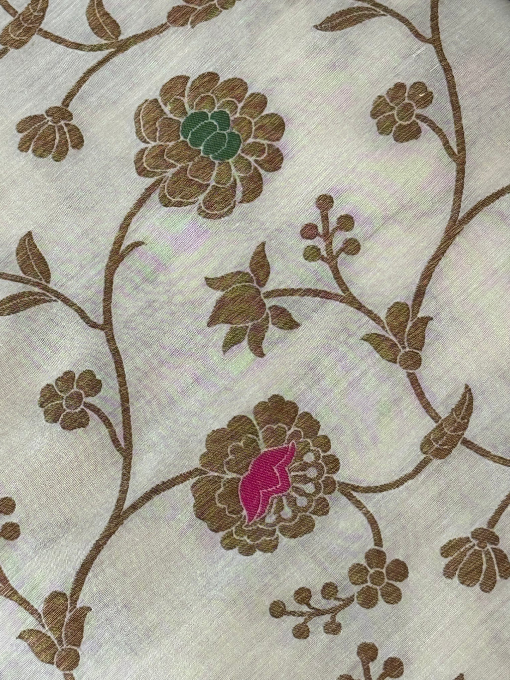 pure Muga silk fabric features an antique zari floral jaal design