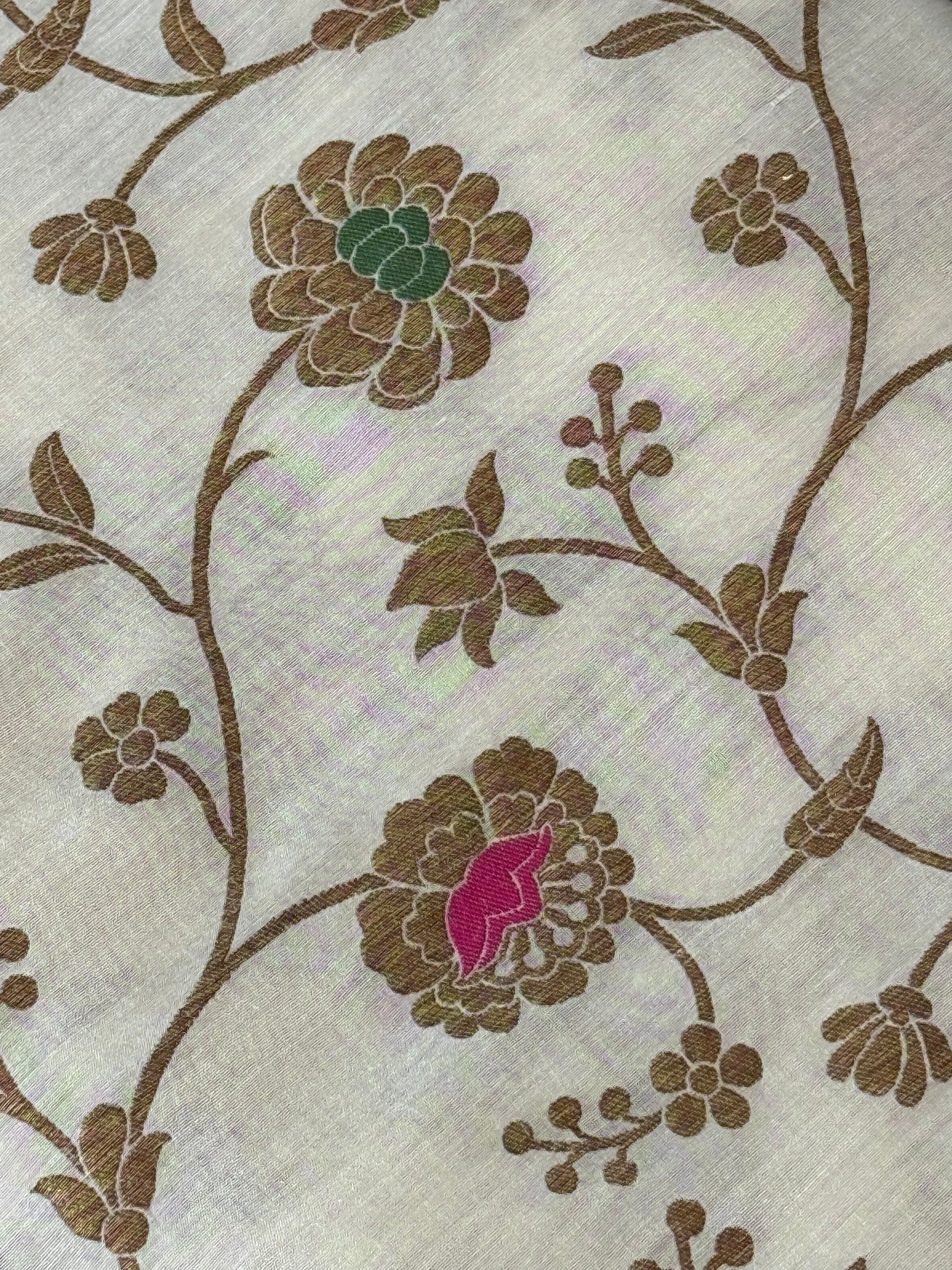pure Muga silk fabric features an antique zari floral jaal design